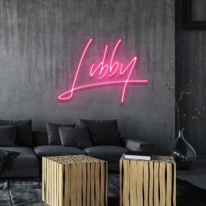 illuminated custom LED neon sign in a retro 80s script style font shown mocked up on wall with clear acrylic backing frame